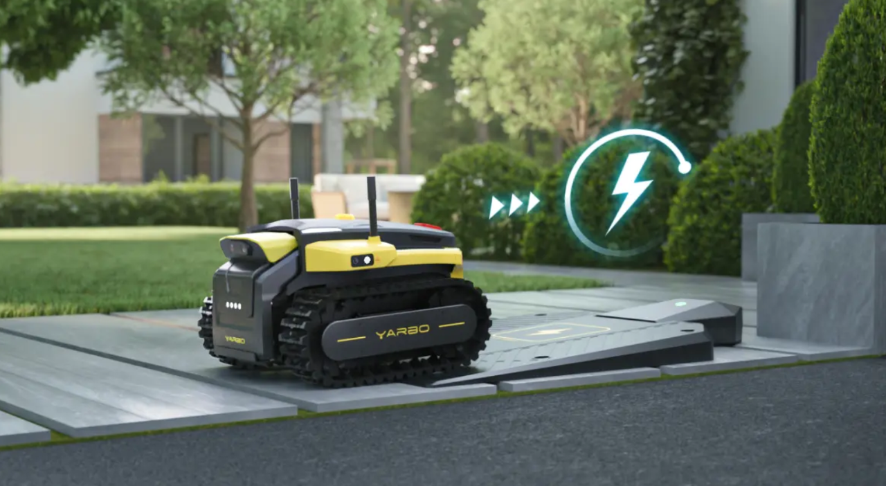 Yellow and black Yarbo robotic lawn mower charging on a sleek dock in a modern garden, glowing battery icon indicating power.