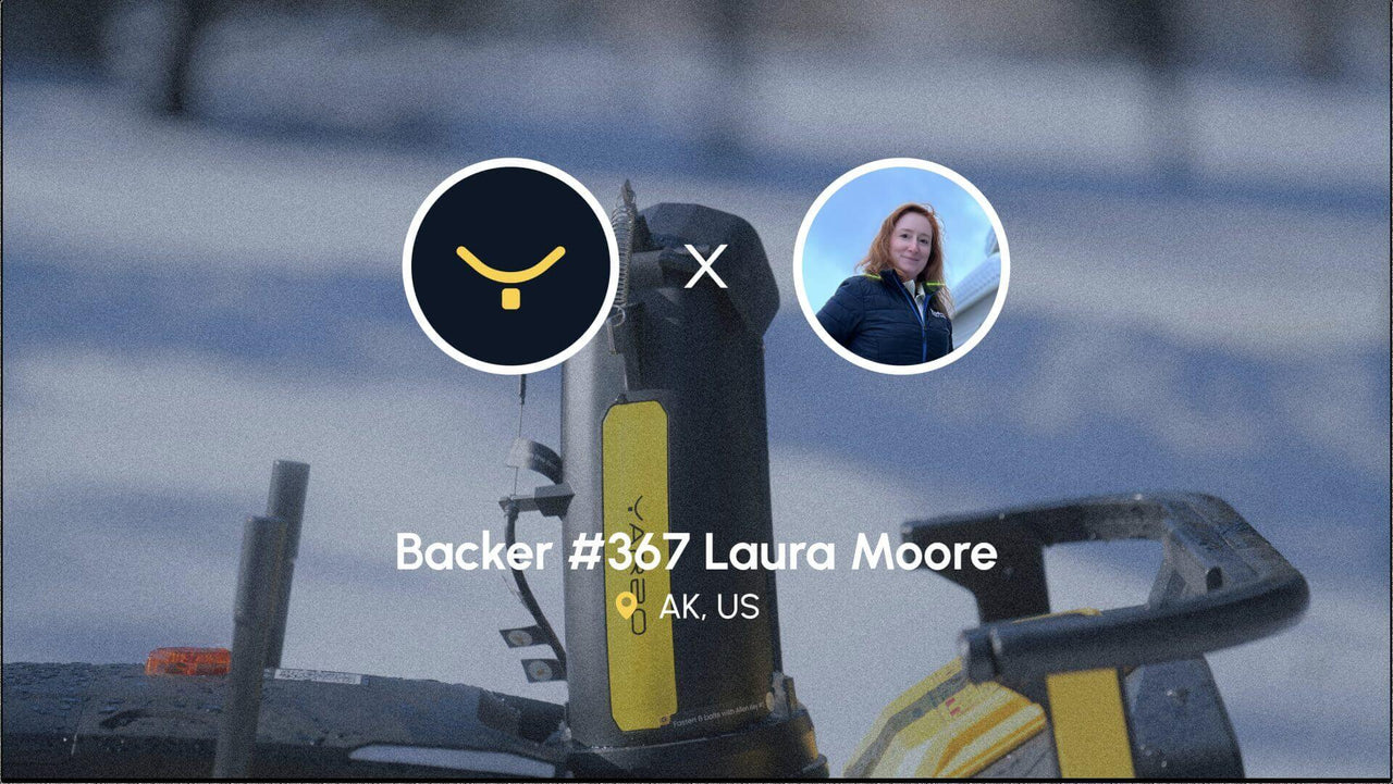 Yarbo device in snowy setting with Laura Moore’s portrait, celebrating her support from Alaska.