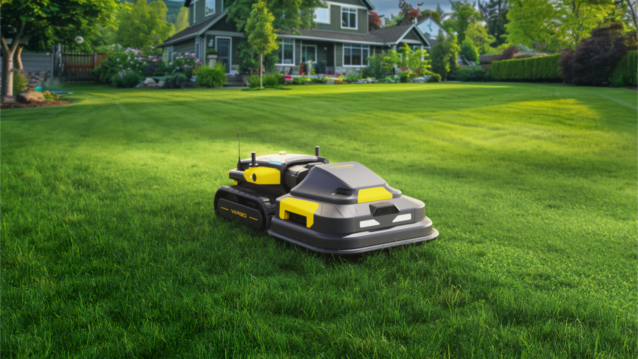Modern robotic lawn mower glides across lush green yard, showcasing smart, hands-free yard maintenance.