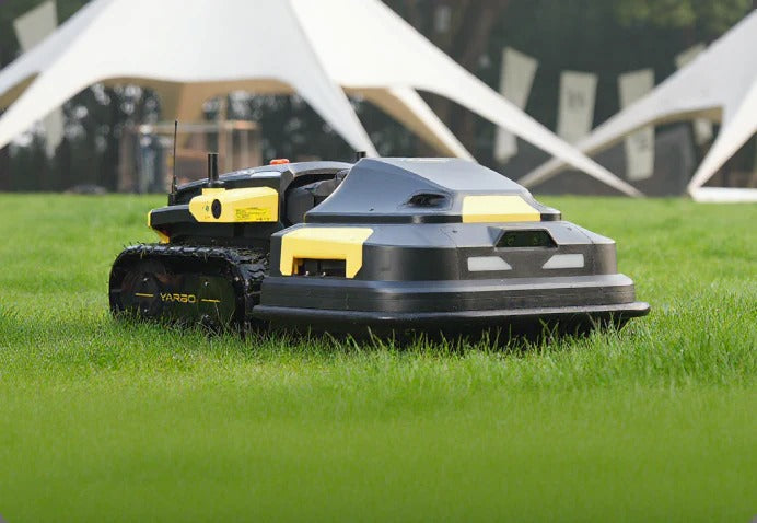 Black and yellow Yarbo robotic lawn mower glides across lush green grass, showcasing smart, efficient lawn care for large yards.