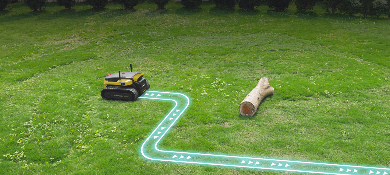 Yellow and black robotic lawn mower on green grass, navigating a glowing blue path around a log.