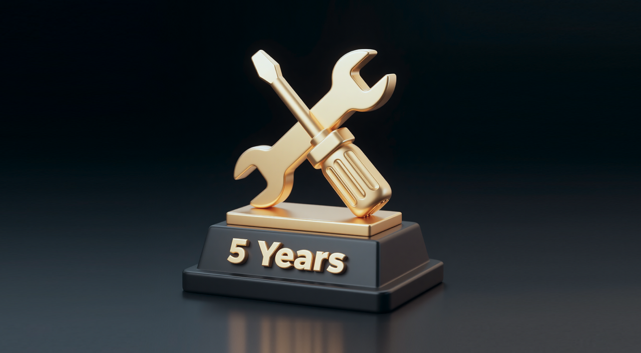 Golden trophy with crossed wrench and screwdriver on black base, engraved "5 Years" in gold.
