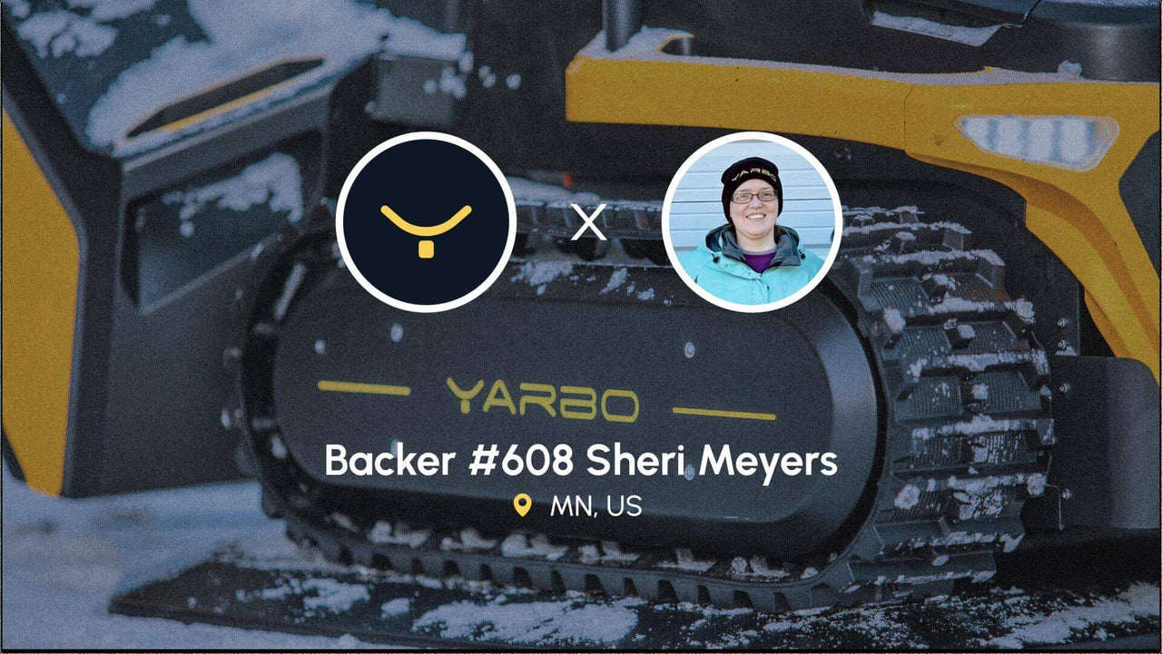 Sheri Meyers, Backer #608, smiles in a Yarbo beanie beside a snowy Yarbo tracked vehicle in Minnesota.