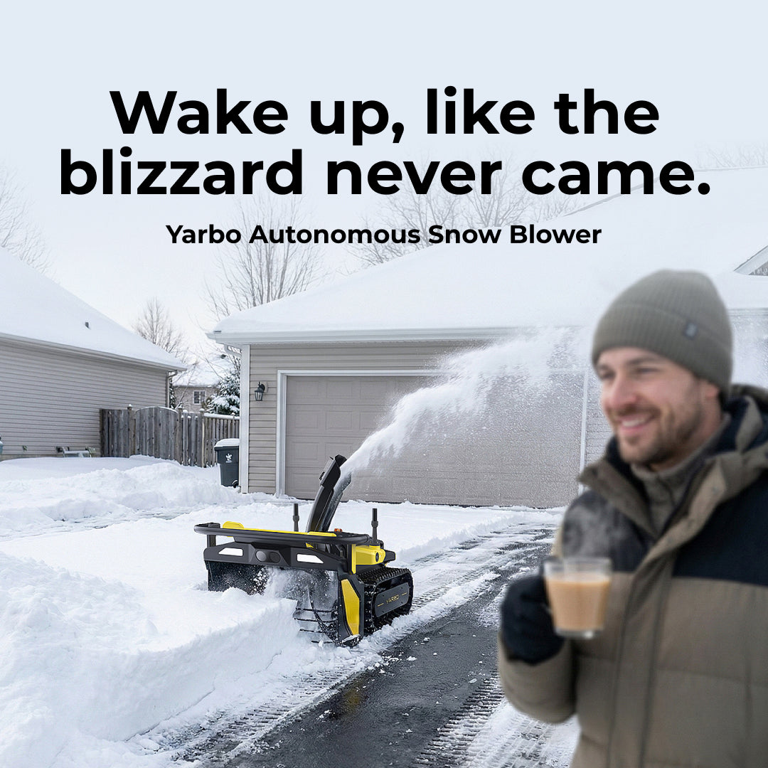 Smiling man sipping coffee as autonomous snow blower clears driveway, snow spraying in winter morning.