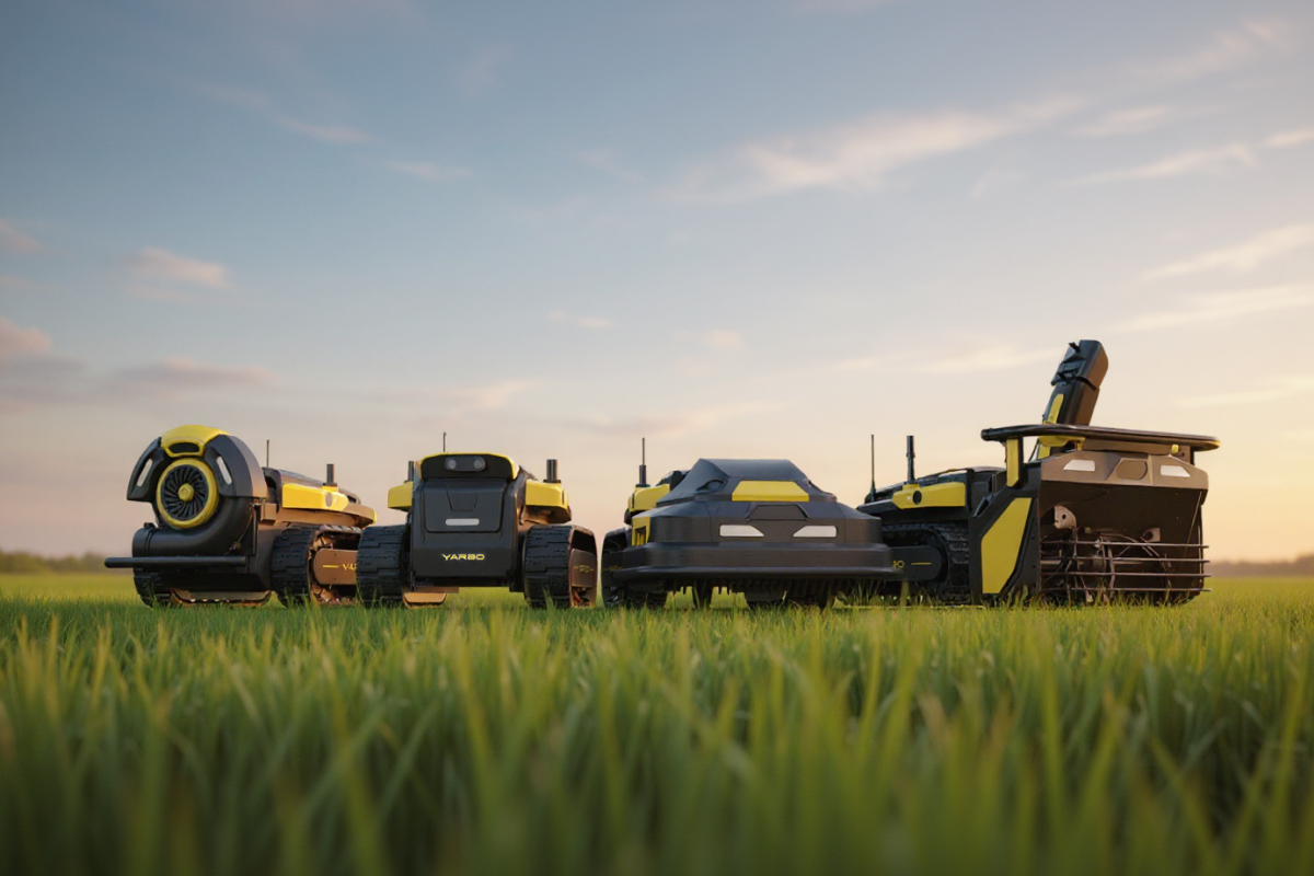 Four Yarbo robotic mowers and snow blowers lined up in a vibrant green field under a soft sunset sky.
