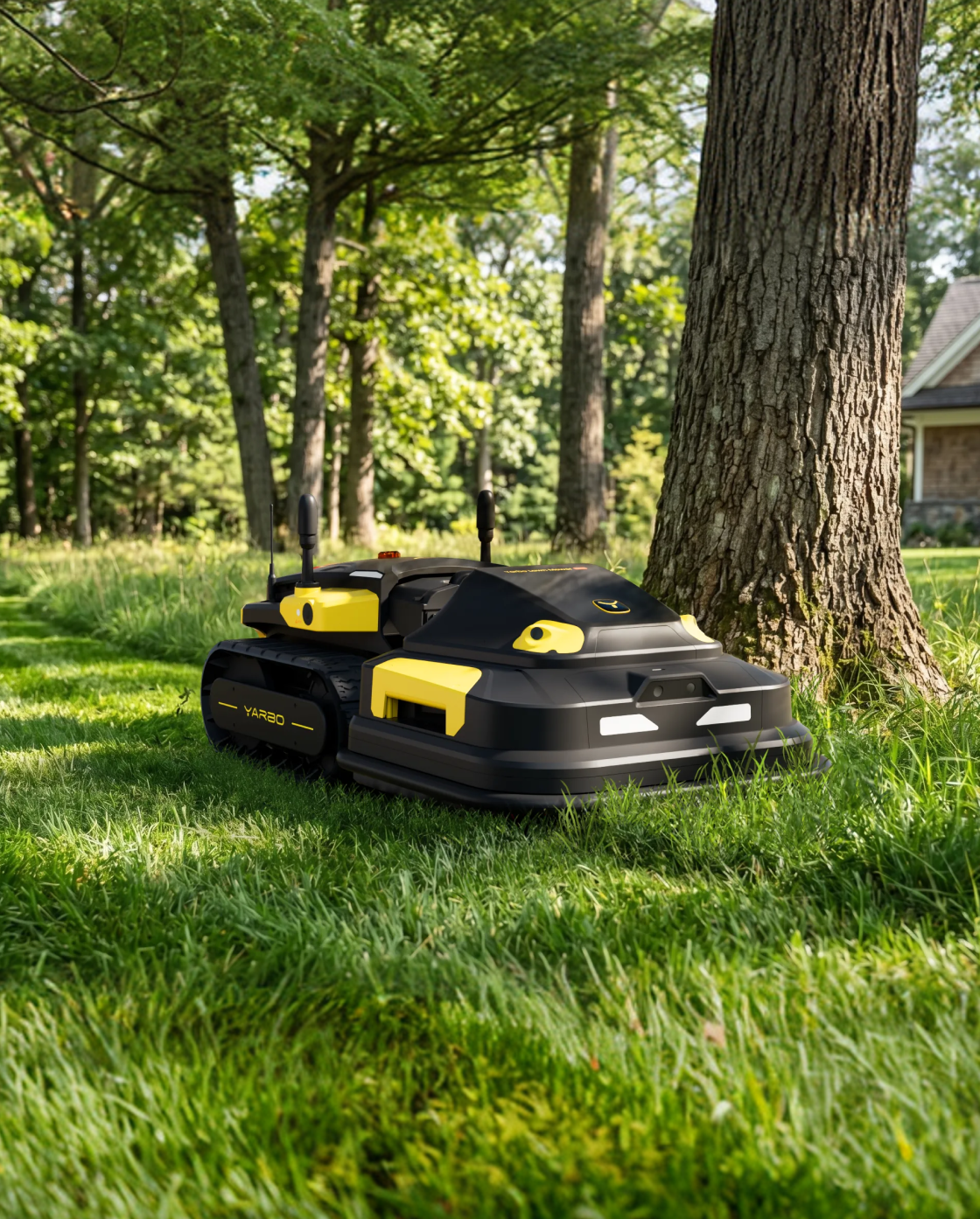 Black and yellow RTK antenna-equipped robotic lawn mower by YARBO, featuring tank treads, dual antennas, and side-mounted controls, shown on grass near a tree in a sunny outdoor setting.