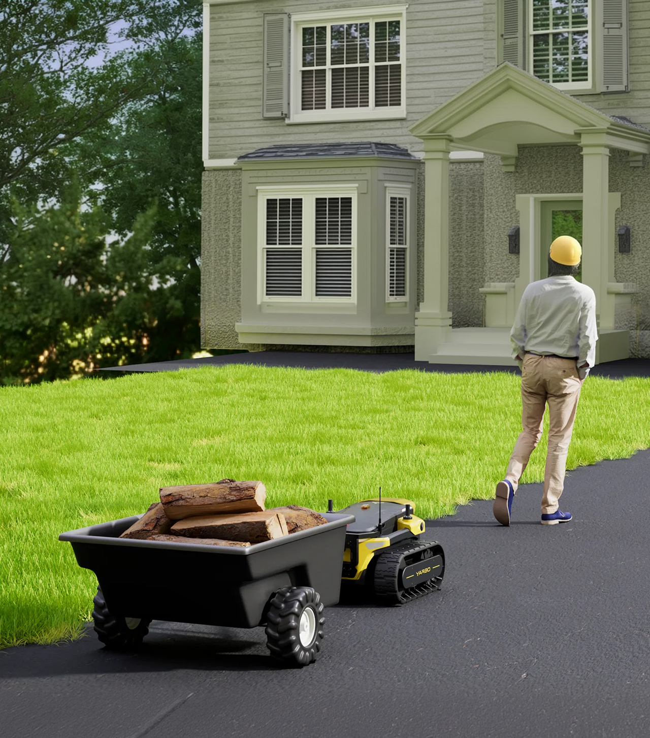 Yellow and black tracked robot pulls black wagon with logs on driveway toward house; person in yellow helmet walks ahead.