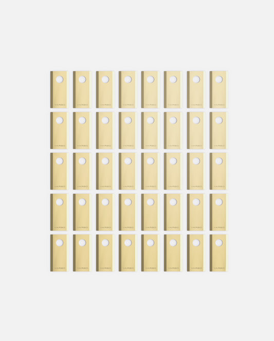 40-piece set of beige YARBO cutting blades with circular holes, arranged in grid, Y Series design, flat lay view