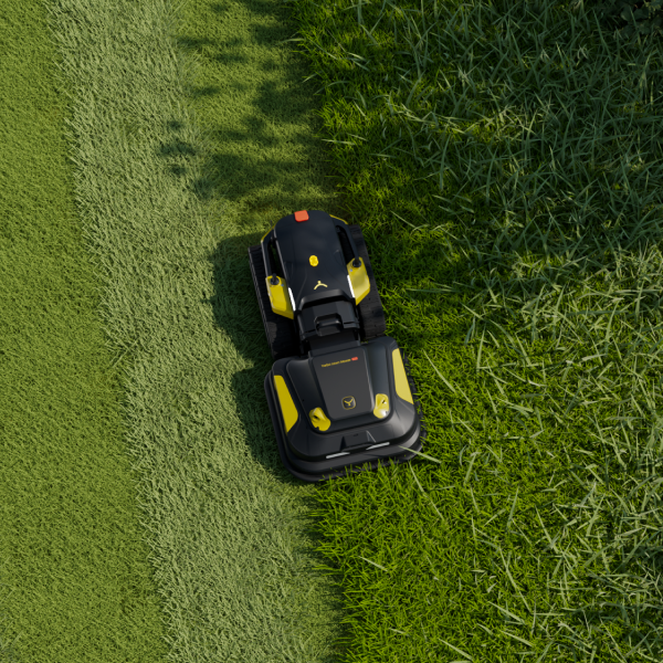 Black and yellow robotic lawn mower on green grass, cutting a neat path, top-down view.