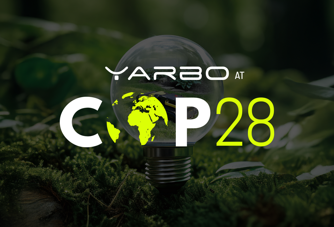 Lightbulb with neon green Earth map sits on moss; text "YARBO at COP28" overlays.