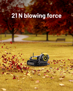 Yellow and black blower module by YARBO on grass, blowing autumn leaves, side view, compact design with visible fan and tracks