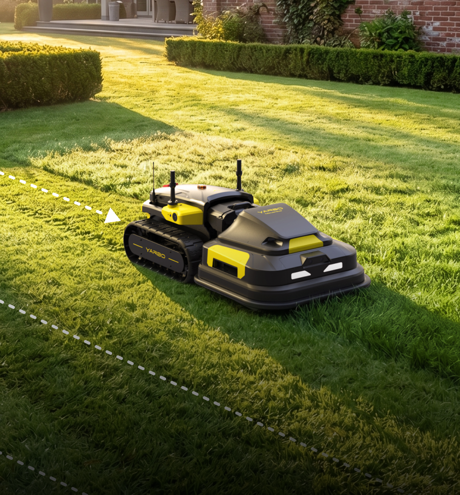 Black and yellow YARD robot mower on green lawn, tracks cutting path, white dashed lines, brick house background, sunny.