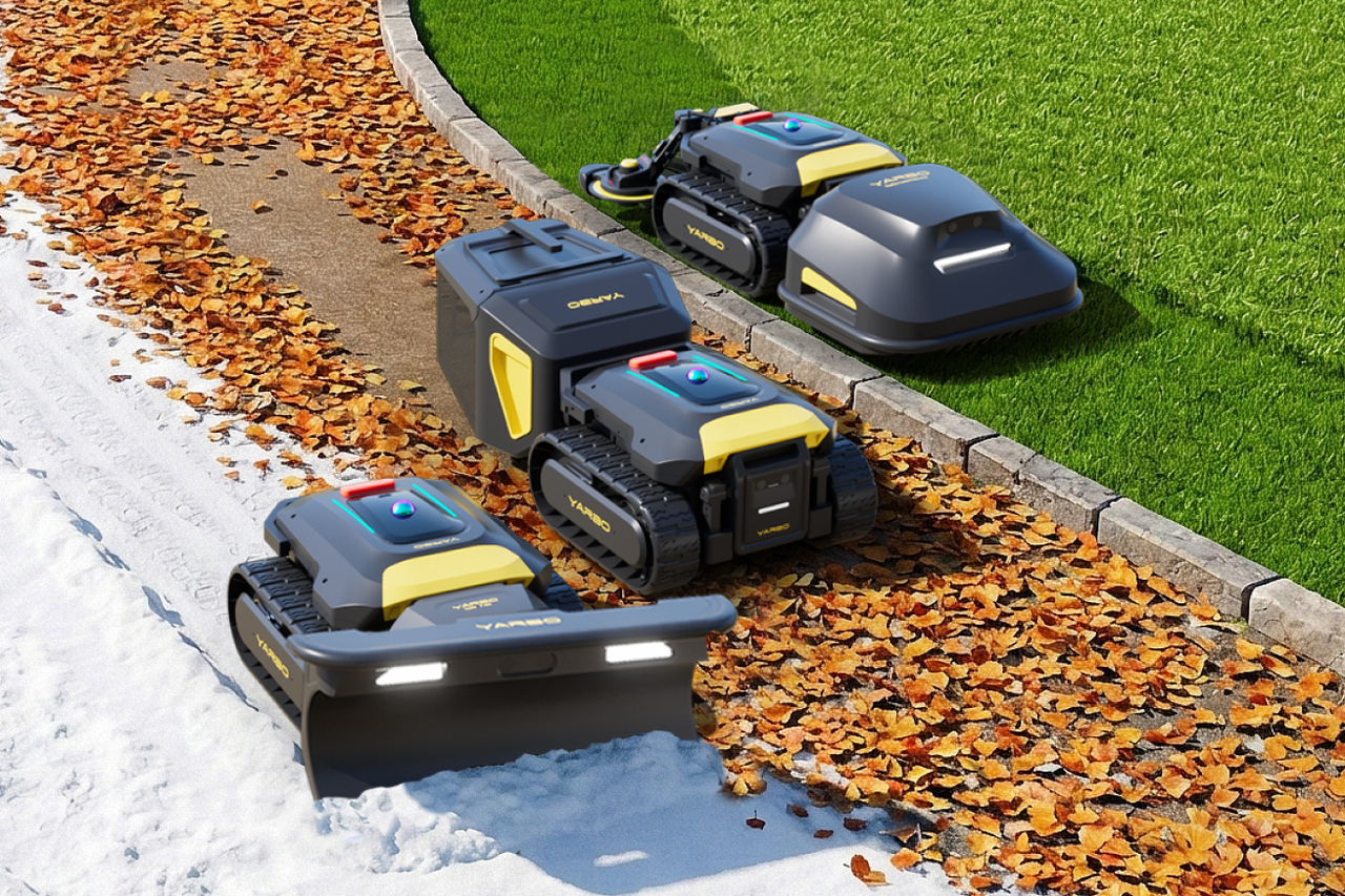 Four YARBO robotic lawn mowers with yellow accents on snow, leaves, and grass, showcasing all-season outdoor use.