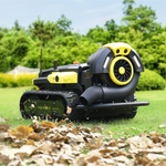 Black and yellow robotic lawn mower by Yarbo with tank treads, blower attachment, and debris collection, on grass with fallen leaves.