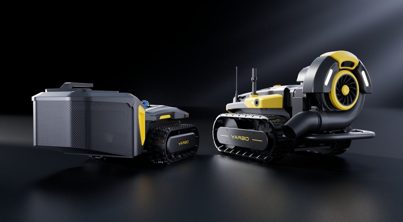 Two black and yellow YARBO tracked robots on dark surface, one with large fan, one with perforated box, both with antennas and illuminated details.