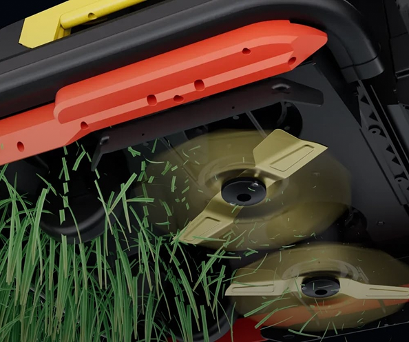 Close-up of lawnmower blades cutting green grass, with red and yellow plastic housing, dynamic motion blur.
