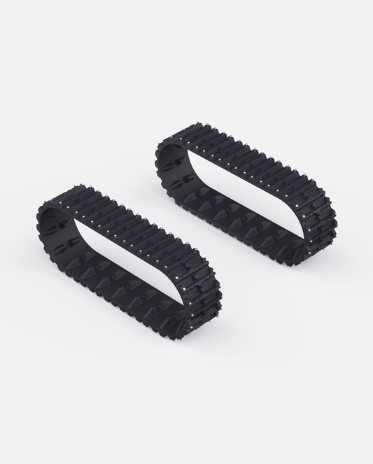 Black rubber snow tracks with aggressive tread pattern and metal studs, shown in side view, Y Series design