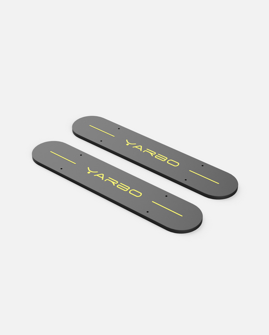Dark gray weighted side plates with yellow YARBO logo and alignment lines, shown in top-down view, by YARBO