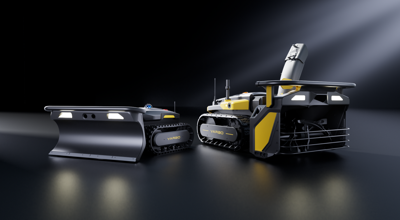 Two YARBO robotic vehicles with tracks, one featuring a plow and the other a robotic arm, displayed on a dark reflective surface with dramatic lighting.