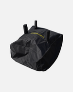 Black textured fabric cover with three top handles and yellow logo, by YARD, shown in angled studio view