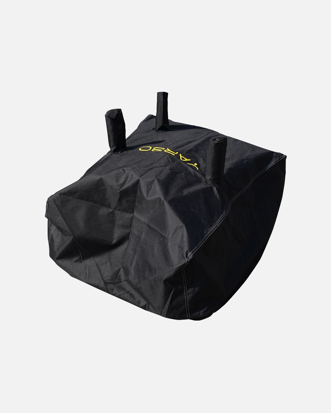 Black textured fabric cover with three top handles and yellow logo, by YARD, shown in angled studio view
