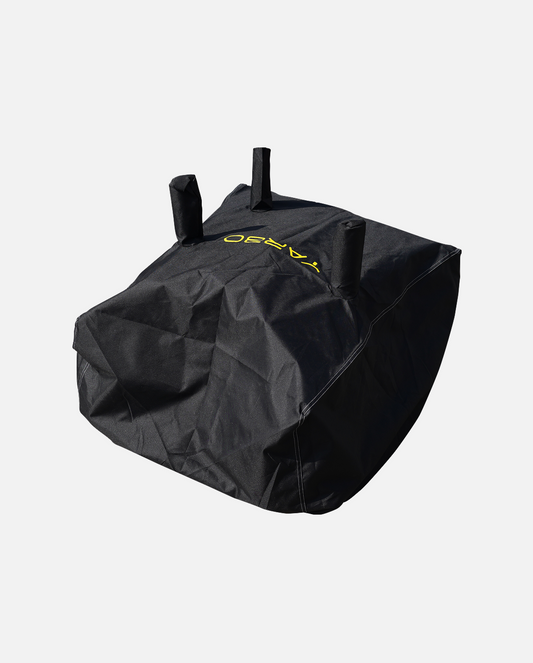 Black textured fabric cover with three top handles and yellow logo, by YARD, shown in angled studio view