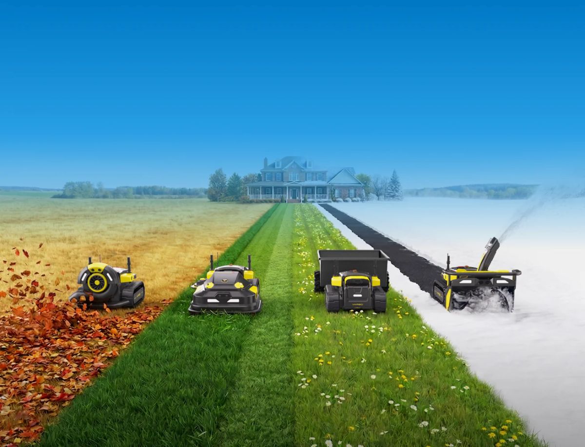 Four yellow and black robotic lawn mowers perform seasonal yard tasks—leaf blowing, mowing, mulching, and snow removal—on a path leading to a house under a clear blue sky.