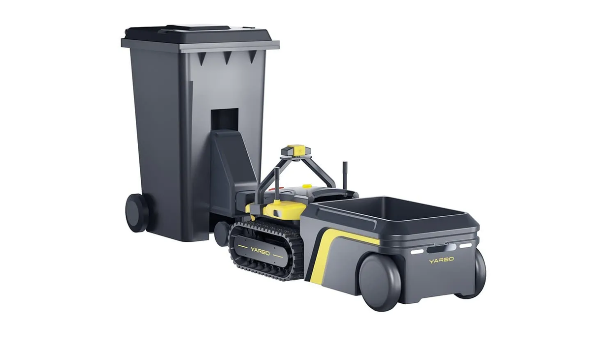 Gray and yellow YARBO robotic waste collector with tracked base, lifting a large black trash bin against a white background.