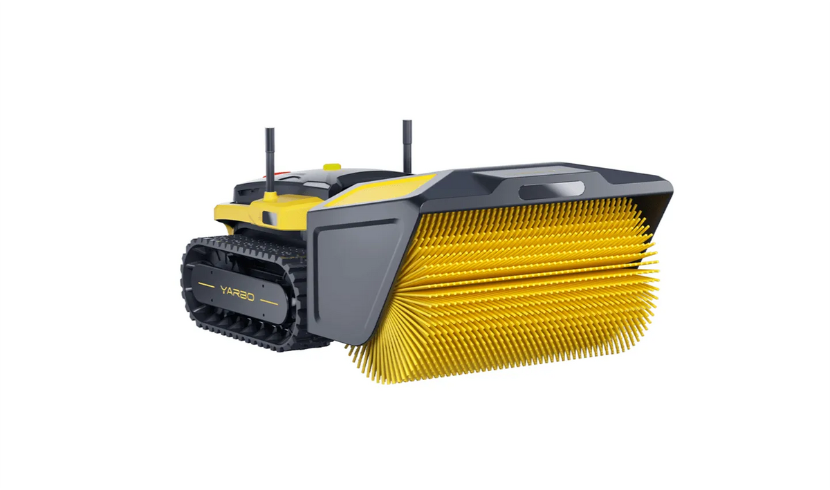 Yellow and black YARBO robotic sweeper with tank treads and wide bristle brush, isolated on white background.